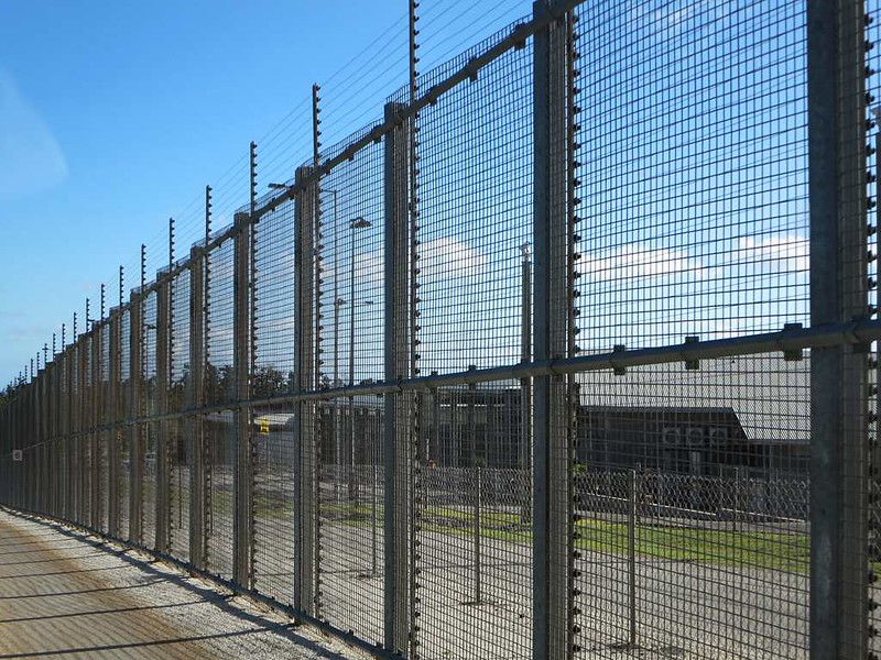 Photography of the border fence at Christmas Island Detention Centre.